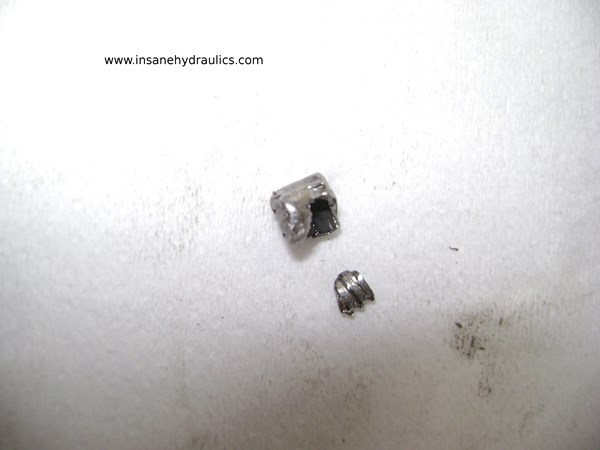 Damaged orifice plug from Rexroth series 52 pump swashplate