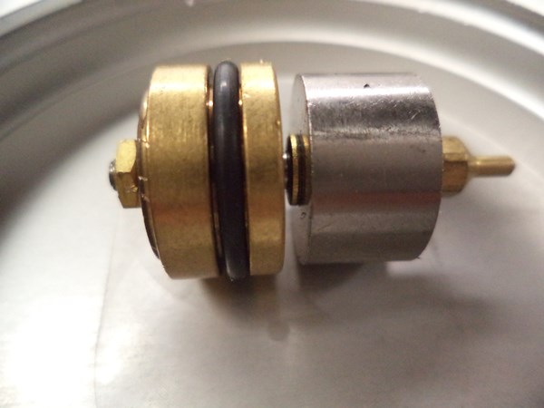 The shiny metallic puck is a diametrically magnetized magnet