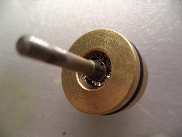 The shaft is supported by a tiny 1/8'' x 5/16'' bearing