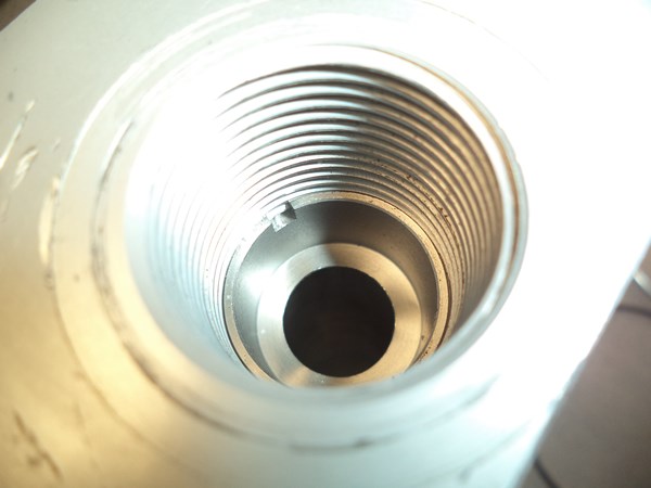 The sharp-edged orifice is held in place with a thread locking glue