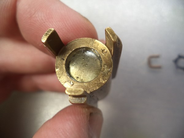 The axially-magnetized magnet is epoxied inside the metering piston