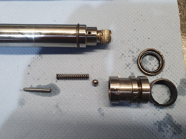 There's a check valve built into the piston