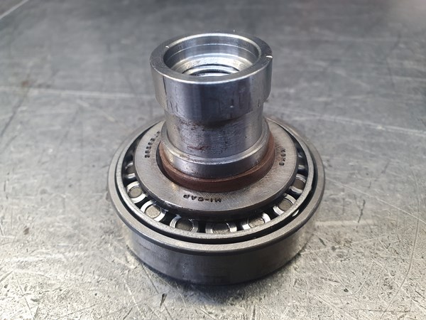 A small bearing makes an excellent compression sleeve for a bronze-filled PTFE piston seal