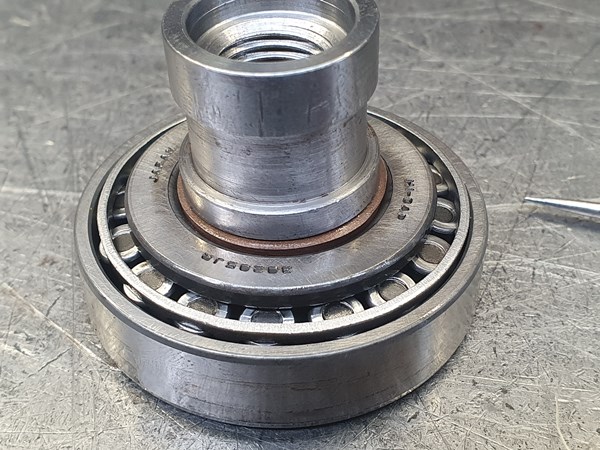 A small bearing makes an excellent compression sleeve for a bronze-filled PTFE piston seal