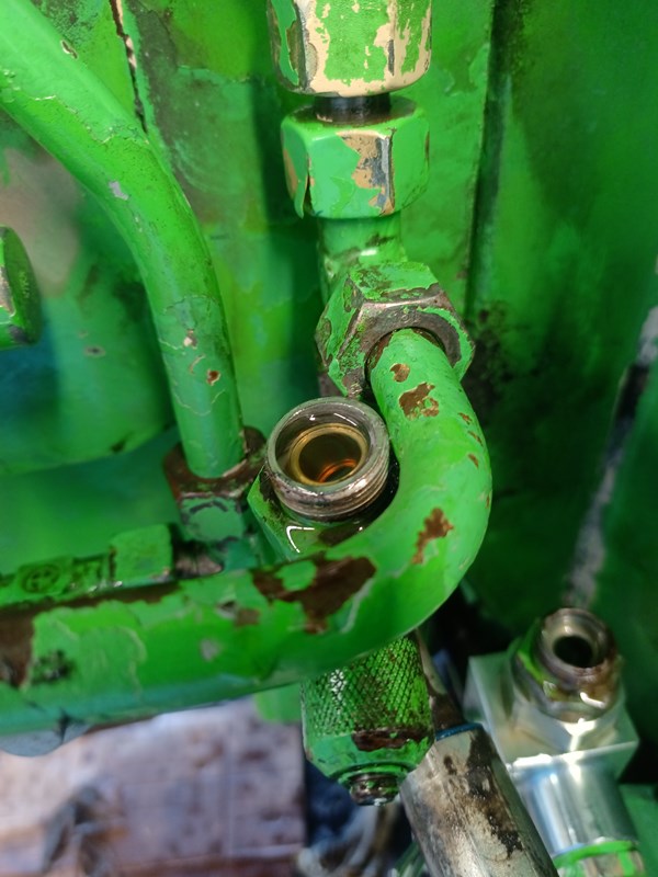 The line connected to the rod end of the cylinders started to fill slowly with oil
