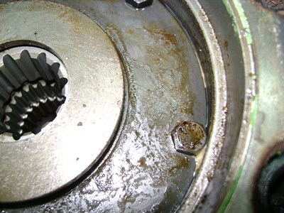 Degraded hydraulic oil deposit on parts