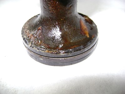 Degraded hydraulic oil deposit on parts