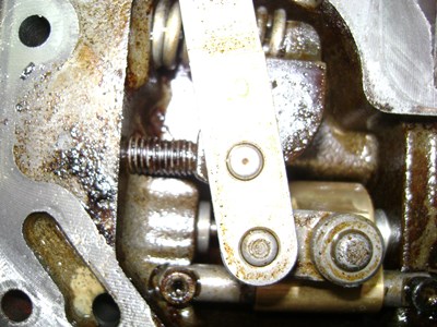 Degraded hydraulic oil deposit on parts
