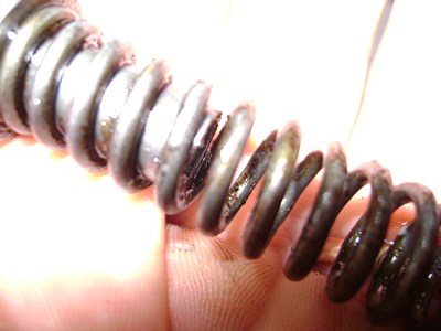 Degraded hydraulic oil deposit on parts