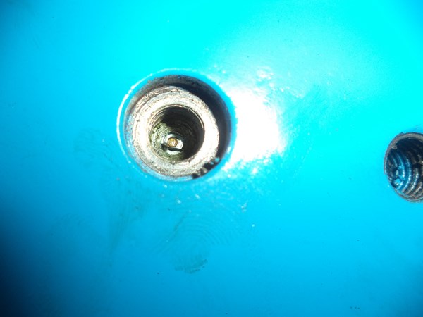 The charging port is an 1/8' BSPP threaded hole with a Schrader valve in the center
