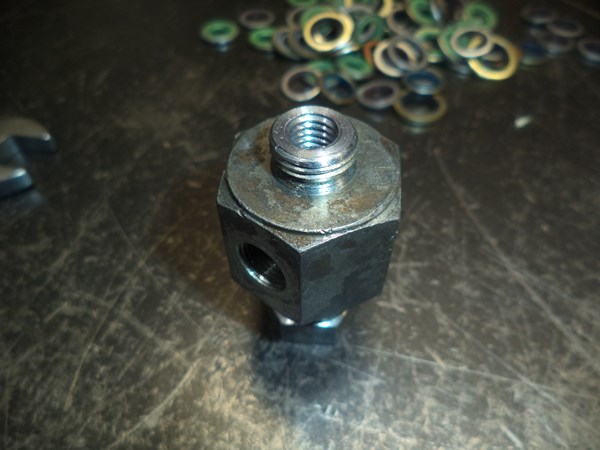 I flattened the male end and tapped a 20-mm-deep M8 hole