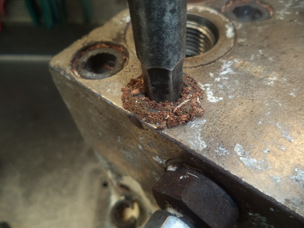 It seems that the rust packed in the counter-bore gap got somehow weakened by the process