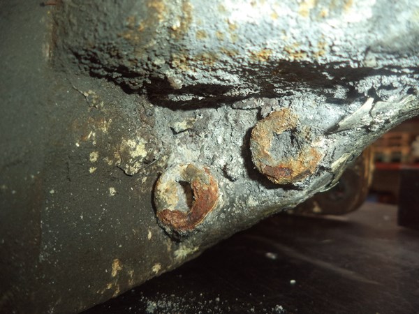 These bolt heads are packed with corrosion