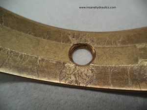 Hard Particle Damage to Cradle Bearing Surface