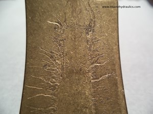 Hard Particle Damage to Cradle Bearing Surface