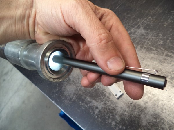 Peeking inside the crimped hose end with a pen flashlight