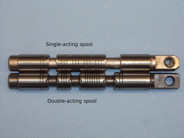 Walvoil SD11 double-acting closed-center spool next to a single-acting spool