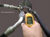 Infrared Thermometer Taking Reading of a Shiny Surface