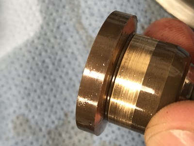 Piston slipper top surface is tapered due to wear