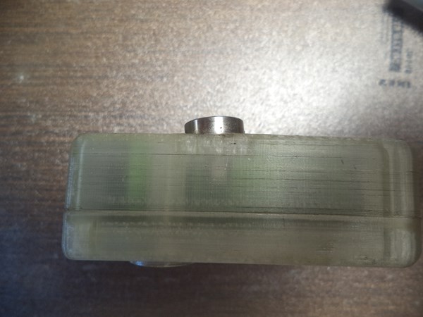 The magnet is crooked because the PLA body got distorted with heat